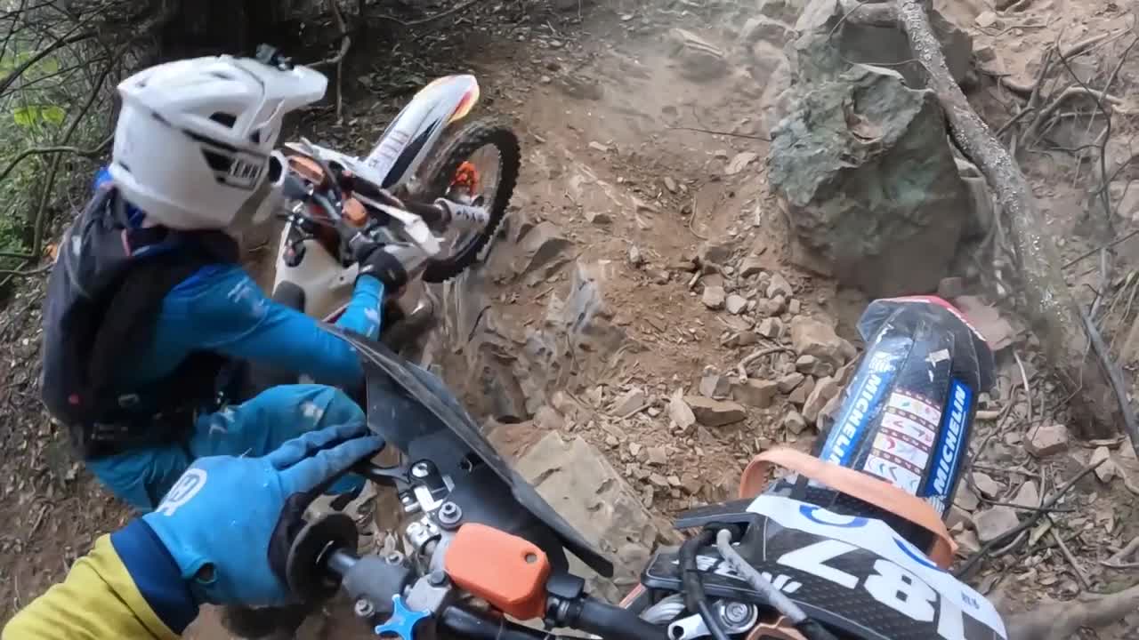 Motocross bike flips backwards and crashes into rider's friend on rocky ...