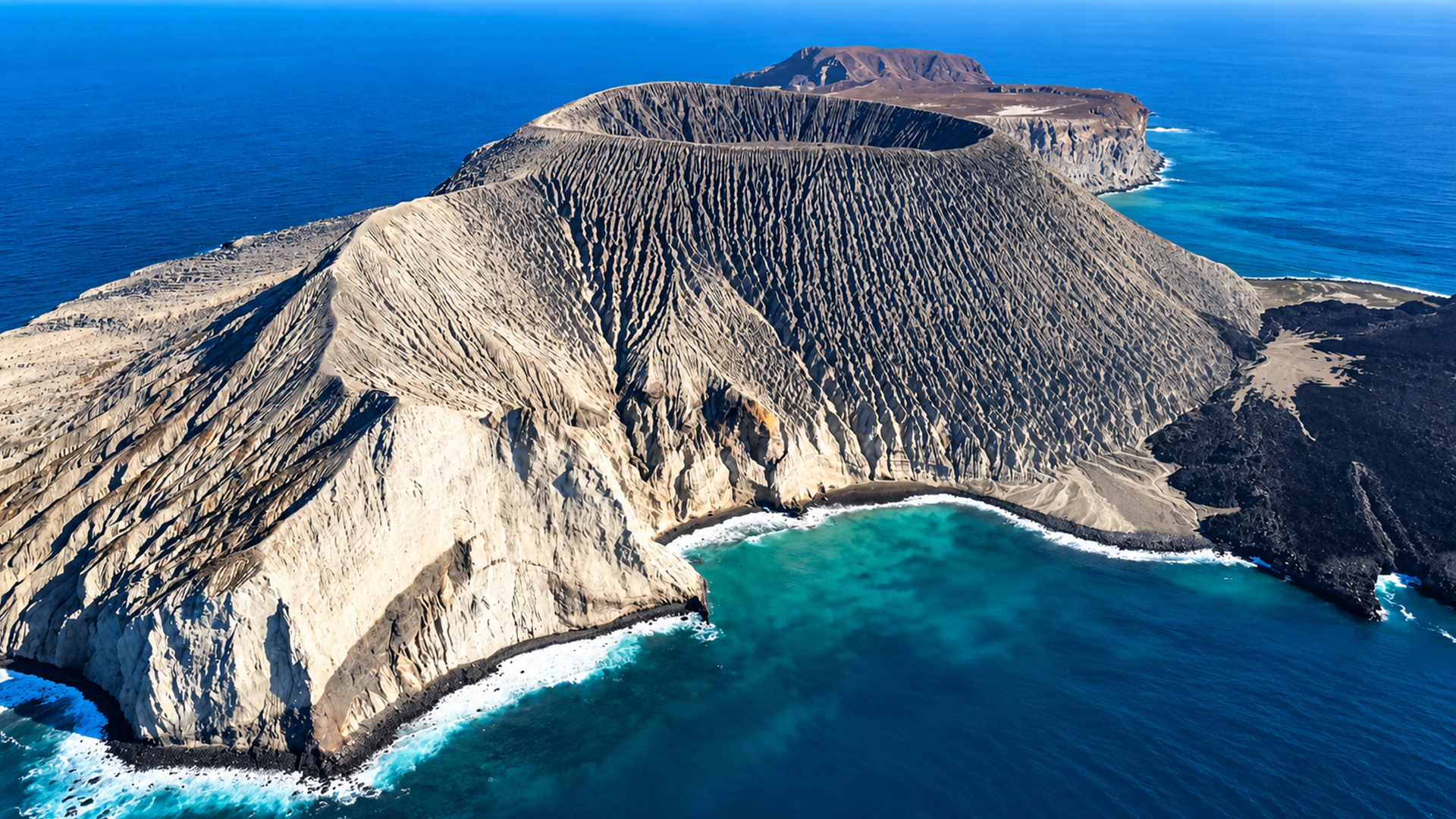 An enormous volcanic island with a deep crater