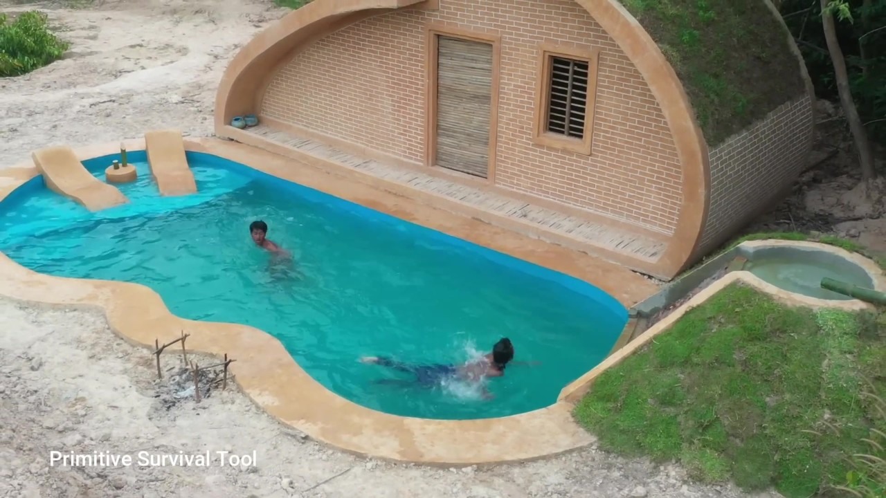 Curved underground house with a pool revealed from above