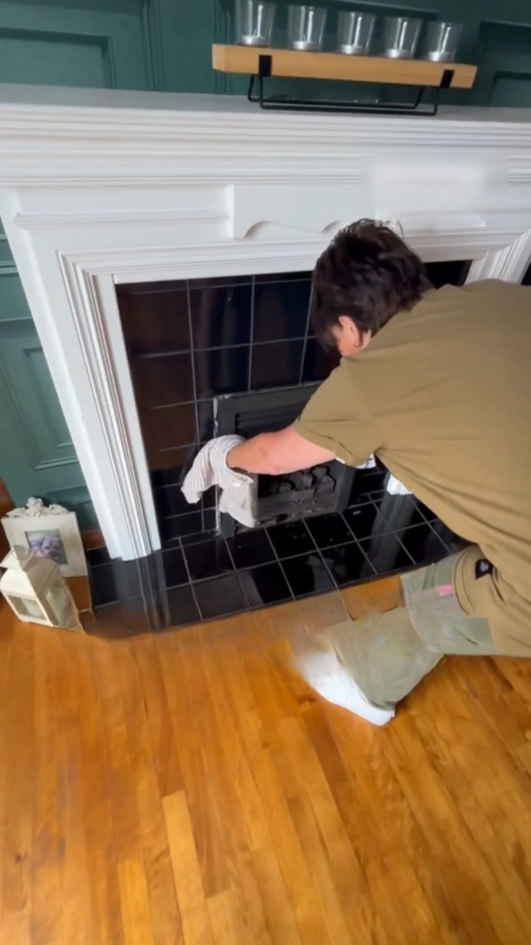 Boy helps a trapped bird escape from a chimney