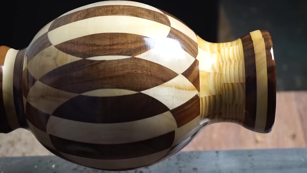 Polished woodturned vase with an interlocking pattern