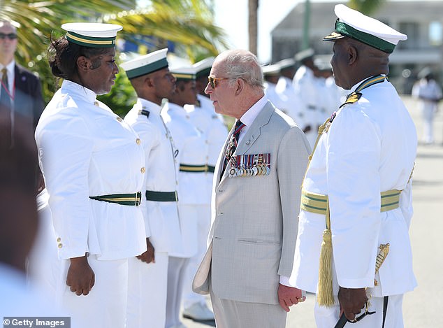 Dancing king! Charles gets in the carnival spirit during Bahamas visit