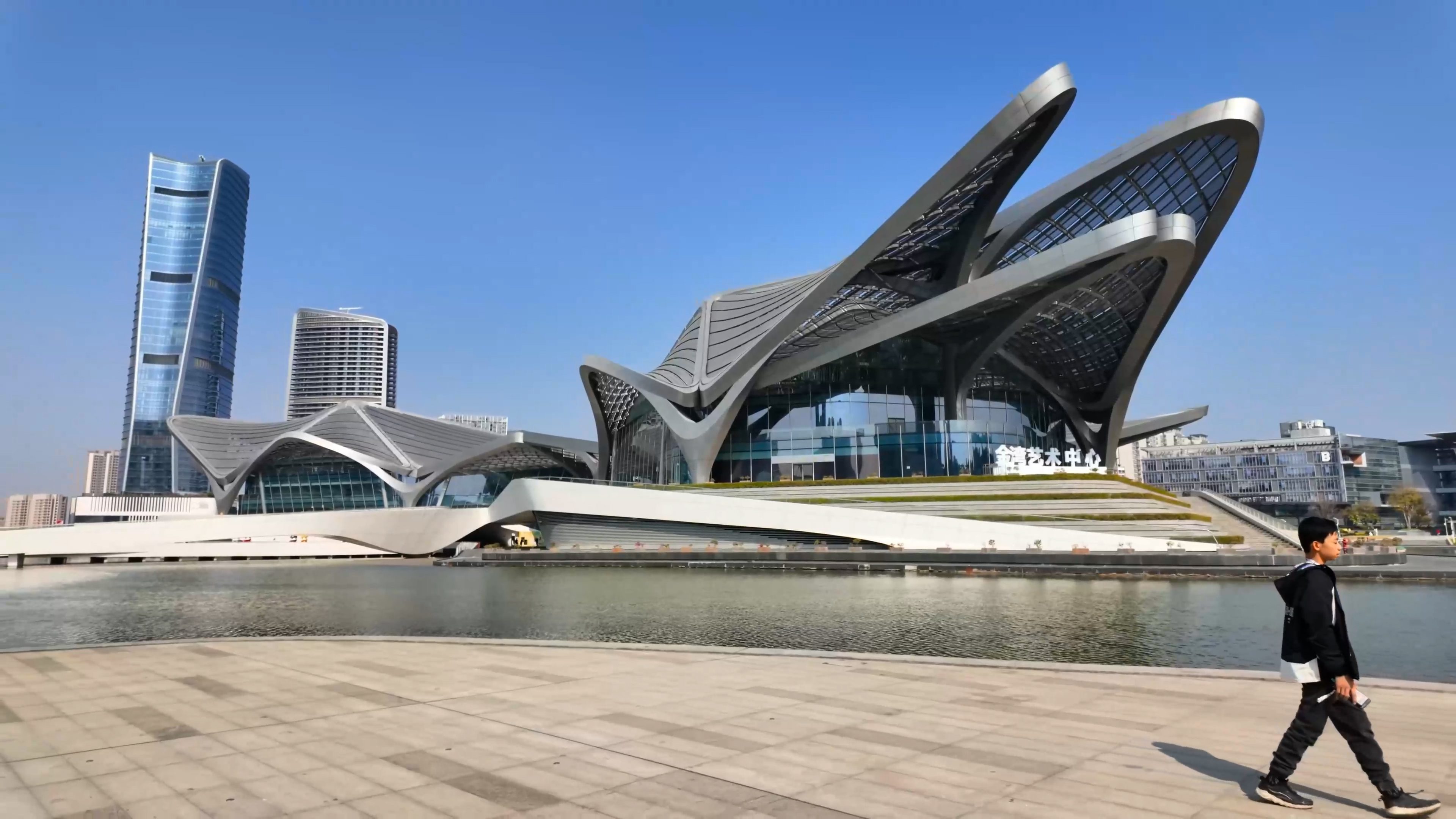 This futuristic building in China has giant wing shaped roofs