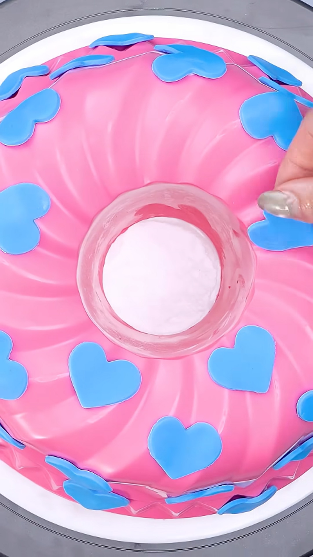 Step by step pink and blue cake decorating process