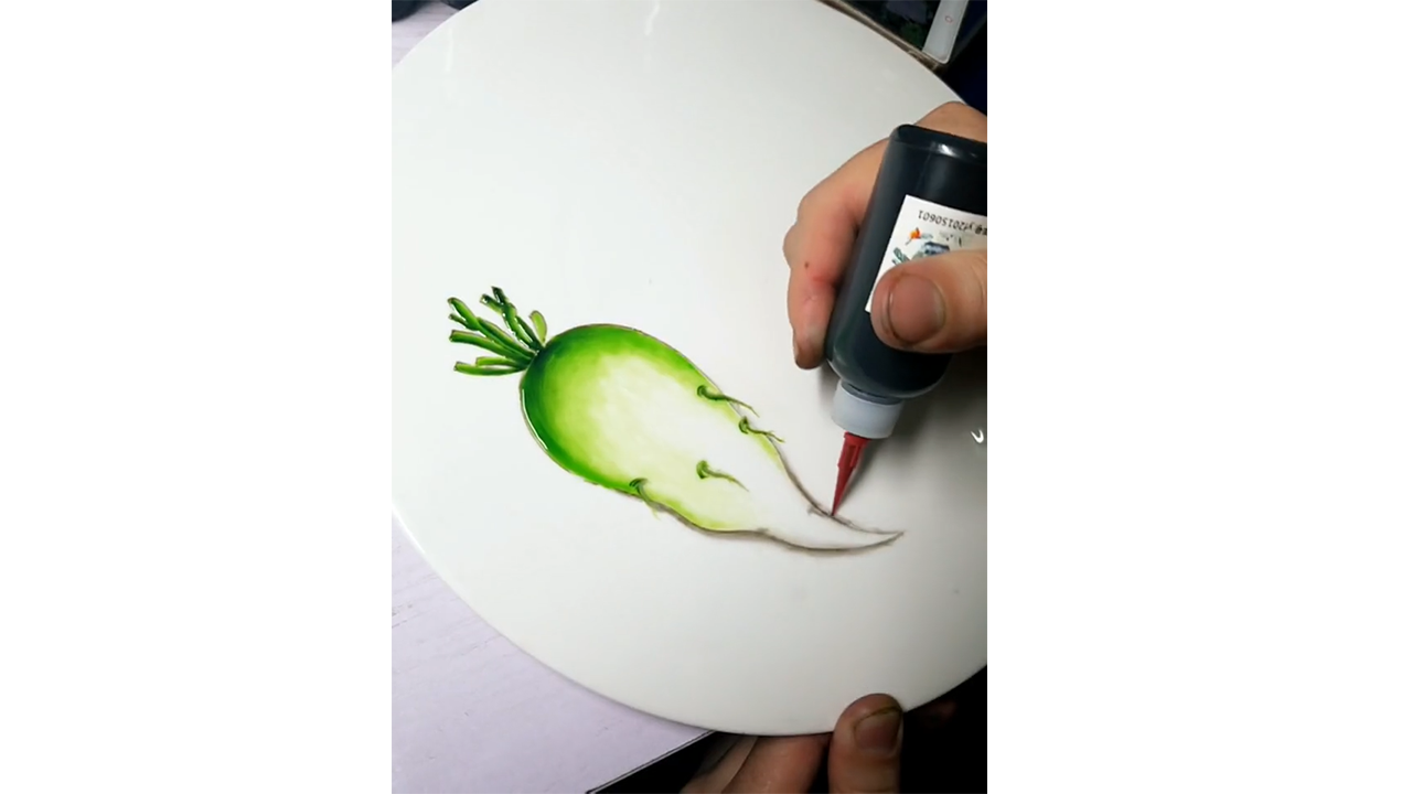 Painting realistic green radish with colored ink creating detailed ...