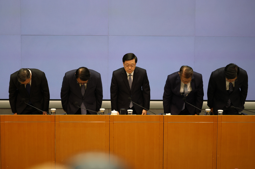 Hong Kong's housing minister resigns after fire investigation finds ...