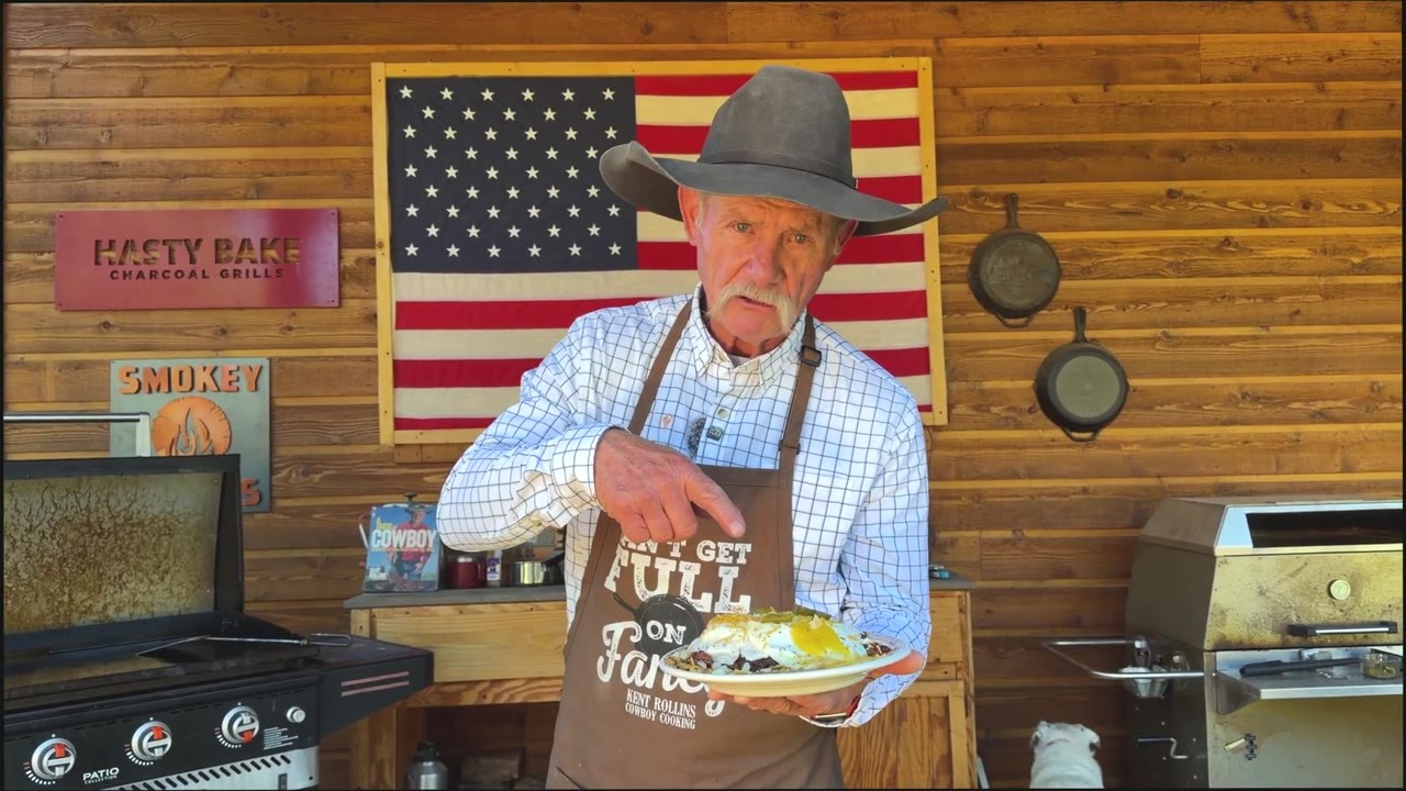 A cowboy stacked chili, eggs and a cheeseburger over crispy hash browns