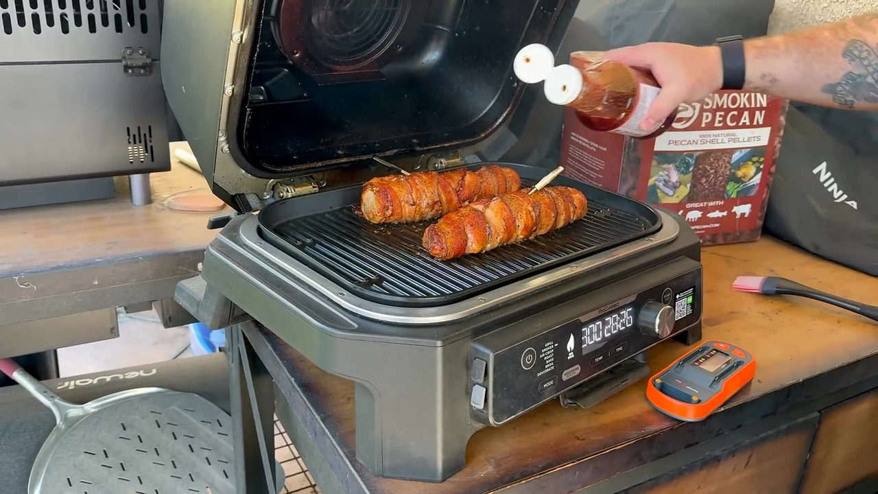 Smoked bacon-wrapped pork tenderloin on a Ninja Woodfire Grill
