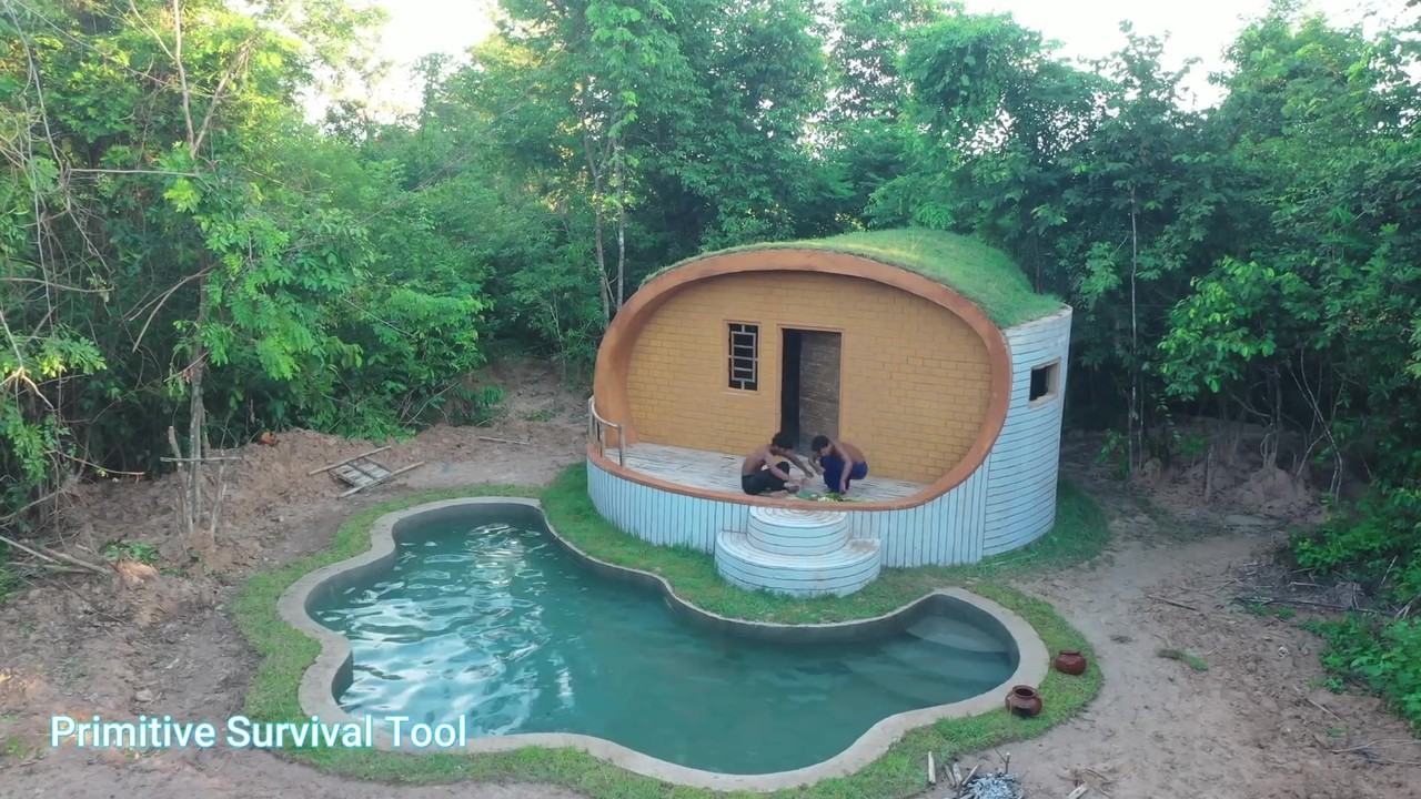 Completed curved underground house with a jungle pool