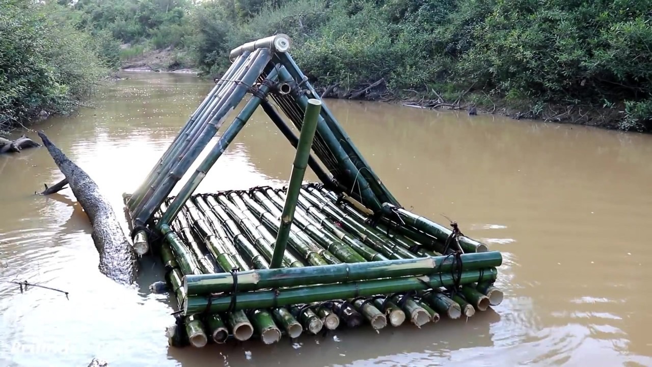 Bamboo raft with an A-frame shelter on the river