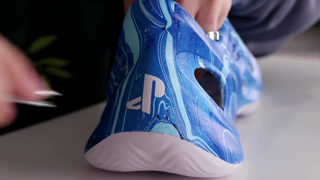 Connor Hydro dips Yeezy foam runners with a PS5 design