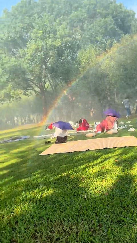 Helicopter's massive water drop drenches family during picnic