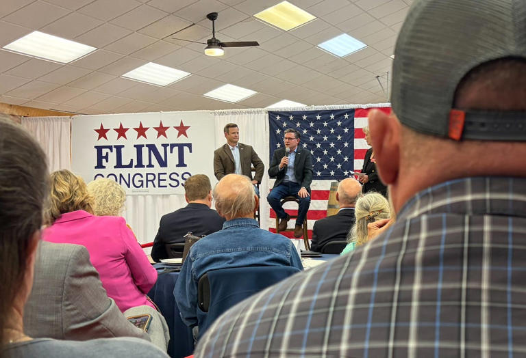 Supporters watch as Republican House Speaker Mike Johnson speaks alongside GOP candidate Aaron Flint at an event in Bozeman, Montana, on Oct. 20, 2026.