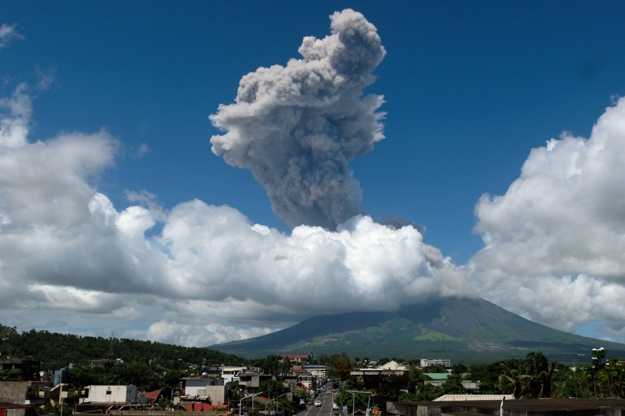 Mayon Volcano erupts spewing ash plumes two miles into the sky