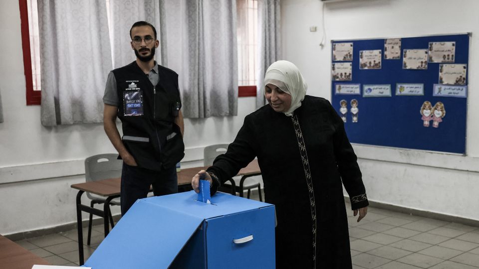 A woman casts her ballot at a polling station in Jerusalem on October 27. - Ahmad Gharabli/AFP/Getty Images