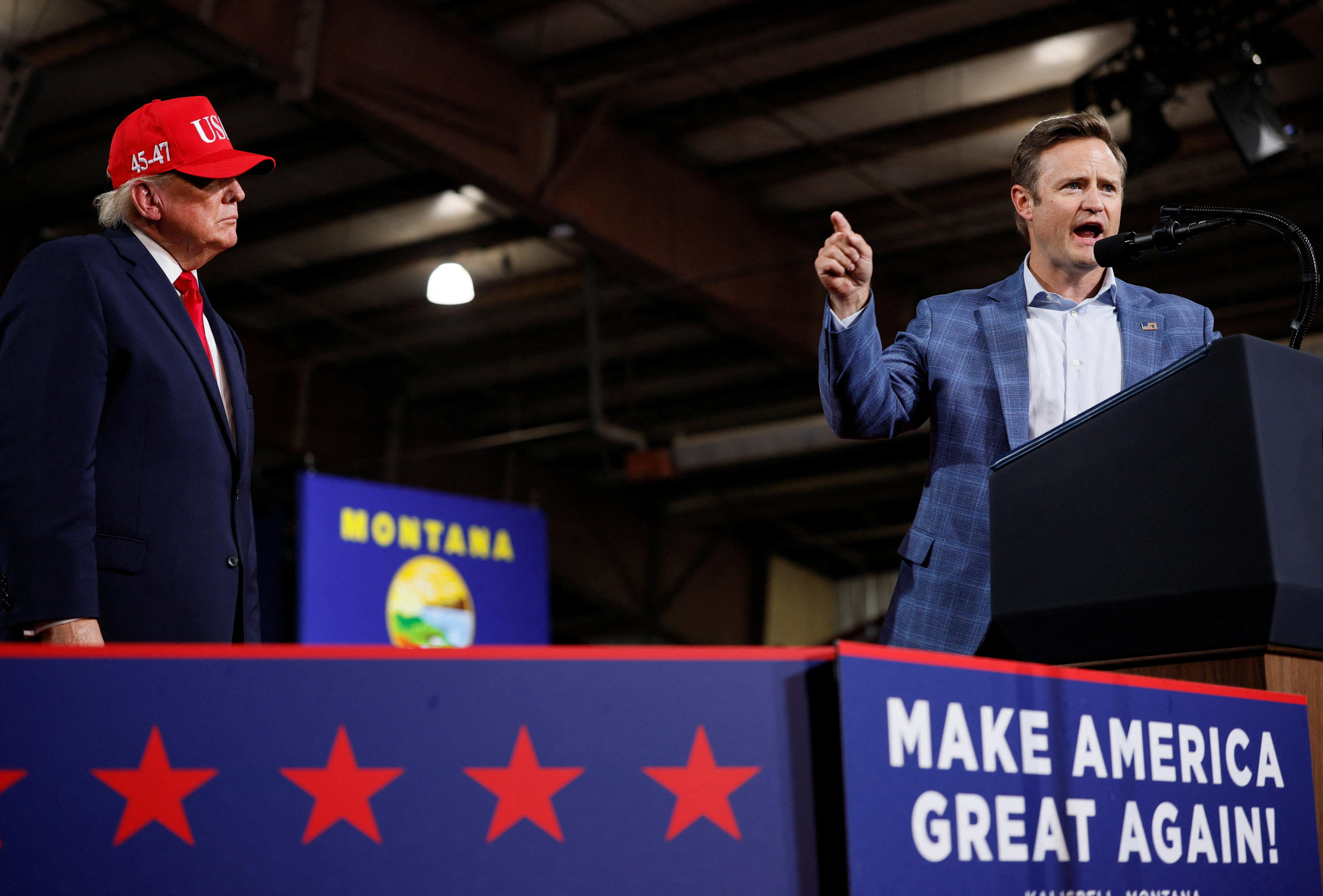 President Trump watches as Republican House candidate Aaron Flint speaks at a campaign rally in Kalispell, Montana, on Oct. 14, 2026.