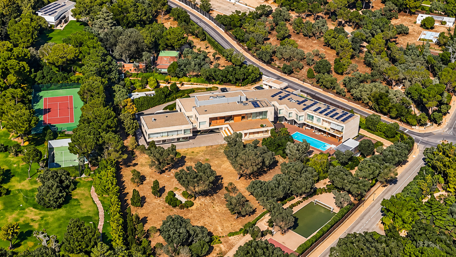 Private tennis courts and pools define this Algarve luxury estate