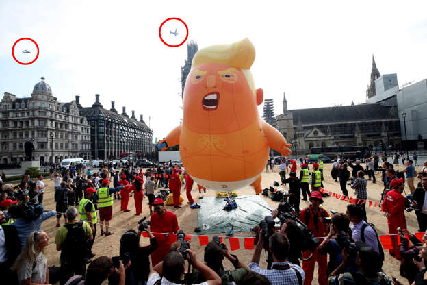 Slide 1 of 29: US Marine helicopters (ringed), which are used by the presidential entourage, pass the 'Baby Trump' balloon as it rises after being inflated in London's Parliament Square, as part of the protests against the visit of US President Donald Trump to the UK. (Photo by Yui Mok/PA Images via Getty Images)