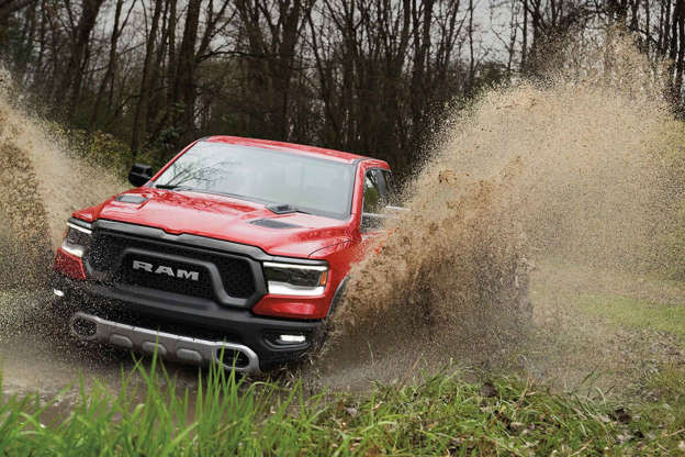 Diapositiva 6 de 12: Starting MSRP: $43,995 The Ram 1500 is all-new for 2019, and the trail-ready Rebel features more off-road goodies than ever before. The standard coil-spring suspension features a one-inch lift, and works with new Bilstein dampers with remote reservoirs keep the shocks cool and the 33-inch Goodyears planted. Revised rear geometry and an electronic-locking rear differential keep the Rebel moving forward. Available four-corner air suspension ($1,795) has five height settings. In addition to making it easier to get in and out of the big Ram, additional ground clearance or better aerodynamics can be had at the touch of a button. Standard power is a 305-horsepower V6 with 269 lb-ft of torque at 1,800 rpm, but thereâ??s an added surprise: a mild hybrid system adds an additional 90 lb-ft while the engine spins up to its useful power curve, an incredibly welcome boost. A conventional 5.7-liter V8 with 395 horsepower and 410 lb-ft of torque is available ($1,195), and also can be had in an eTorque version that adds up to 130 lb-ft when needed ($1,995). As befits any serious off-road er, the Rebel comes with skid plates protecting the steering system, oil pan, gas tank, and transfer case. Beefy tow hooks are installed, ready to yank lesser vehicles out of the weeds. Explore the Ram 1500 on MSN Autos | Find a Ram 1500 in your area