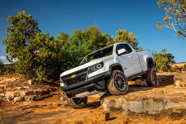 Diapositiva 2 de 12: Starting MSRP: $40,995 (2018) From desert running to rock crawling, the Chevy Colorado ZR2 offers impressive capability and performance while giving up nothing when it comes to daily use. With a revised, high-performance suspension, the ZR2 rides two inches higher than the standard Colorado. There are taller springs up front, along with cast-iron control arms for increased strength. The rear has revised leaf springs to match the front lift, and the track is 3.5 inches wider on both axles. Advanced dampers front and rear are built by Canadaâ??s Mulitmatic and employ spool valves rather than pistons to control the hydraulic fluid inside. The result is a shock absorber with variable compression and rebound rates dependent on velocity and load, making it incredibly tunable. On the road or under light duty, the ZR2 is as composed as a Buick. Give â??er the beans in the dirt, such as desert running or washboard roads, and the ZR2 does an admirable job of keeping the wheels planted without undue battering of its occupants. Under the hood lies a standard 308-horsepower V6 with 275 lb-ft of torque, more than enough to keep the midsize Colorado moving forward with aplomb. Drivers wanting a bit more towing capacity can opt for the Duramax turbodiesel with a whopping 369 lb-ft, capable of hauling up to 5,000 pounds. Power is sent to the wheels through electronic locking differentials front and rear, capable of being locked up in nine different configurations for maximum traction in any terrain. And, with the ability to take drivers anywhere they think they want to go, functional rock sliders and skid plates keep the ZR2 in one piece when the going gets tougher than expected. Learn more about the Chevrolet Colorado on MSN Autos | Find a Chevrolet Colorado in your area