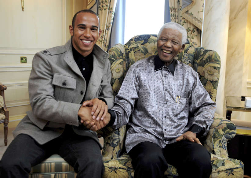 Slide 3 of 28: LONDON - JUNE 24: Lewis Hamilton meets with Nelson Mandela ahead of the 46664 concert being held in Hyde Park on Friday the 27th of June, at the Dorchester Hotel on June 24, 2008 in London, England. Nelson Mandela is on a one week visit to London, where he is due to attend a gala dinner celebrations, and a birthday concert in his honour to raise funds for the fight against HIV and AIDS. (Photo by Dave M. Benett/Getty Images)