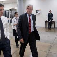 Sen Sheldon Whitehouse, D-R.I., walks through the Senate Subway as he arrive at the Capitol for policy luncheons, Tuesday, Sept. 25, 2018, in Washington. (AP Photo/Andrew Harnik)