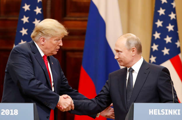 Slide 1 of 21: U.S. President Donald Trump and Russian President Vladimir Putin shake hands as they hold a joint news conference after their meeting in Helsinki, Finland July 16, 2018. REUTERS/Grigory Dukor