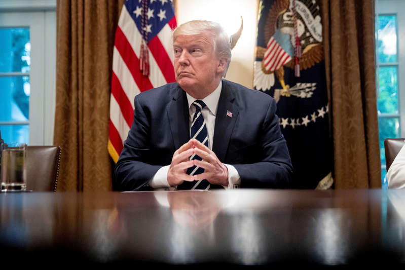 President Donald Trump waits for members of the media get set up before speaking in the Cabinet room of the White House, Tuesday, July 17, 2018, in Washington. Trump says he meant the opposite when he said in Helsinki that he doesn't see why Russia would have interfered in the 2016 U.S. elections.. (AP Photo/Andrew Harnik)