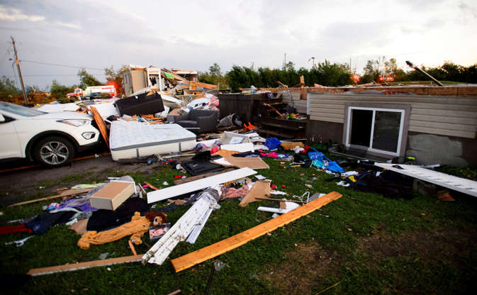 People collect personal effects from damaged homes following a tornado in Dunrobin, Ont. west of Ott... - THE CANADIAN PRESS/Sean Kilpatrick Slide 6 of 21: People collect personal effects from damaged homes following a tornado in Dunrobin, Ont. west of Ottawa on Sept. 21, 2018. A tornado damaged cars in Gatineau, Que., and houses in a community west of Ottawa on Friday afternoon as much of southern Ontario saw severe thunderstorms and high wind gusts, Environment Canada said.