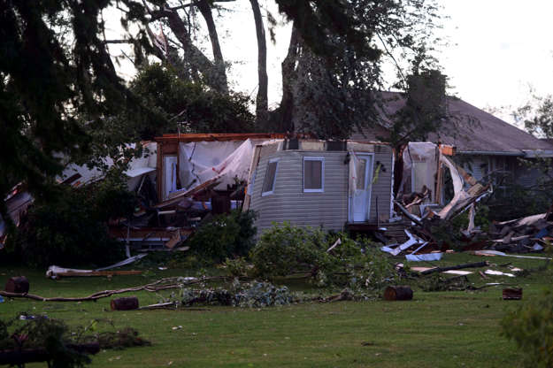Damage from a tornado is seen in Dunrobin, Ont. west of Ottawa on Sept. 21, 2018. A tornado damaged ... - THE CANADIAN PRESS/Sean Kilpatrick Slide 11 of 21: Damage from a tornado is seen in Dunrobin, Ont. west of Ottawa on Sept. 21, 2018. A tornado damaged cars in Gatineau, Que., and houses in a community west of Ottawa on Friday afternoon as much of southern Ontario saw severe thunderstorms and high wind gusts, Environment Canada said.