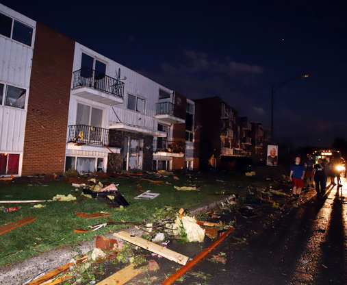 Apartment buildings are shown when roofs off and windows were blown out after a tornado caused exten... - THE CANADIAN PRESS/Sean Kilpatrick Slide 3 of 21: Apartment buildings are shown when roofs off and windows were blown out after a tornado caused extensive damage to a Gatineau, Que. A tornado damaged cars in Gatineau, Que., and houses in a community west of Ottawa on Friday afternoon as much of southern Ontario saw severe thunderstorms and high wind gusts, Environment Canada said.