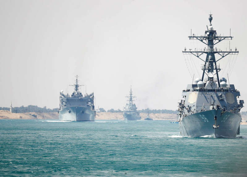 In this Thursday, May 9, 2019 photo released by the U.S. Navy, the Abraham Lincoln Carrier Strike Group transits the Suez Canal in Egypt. The aircraft carrier and its strike group are deploying to the Persian Gulf on orders from the White House to respond to an unspecified threat from Iran. (Mass Communication Specialist 3rd Class Darion Chanelle Triplett/U.S. Navy via AP)