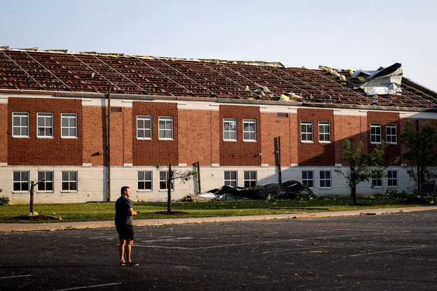 Slide 39 of 75: A section of roof remains torn from Brookville High School after a tornado hit the area the previous evening, Tuesday, May 28, 2019, in Brookville, Ohio.  (AP Photo/John Minchillo)