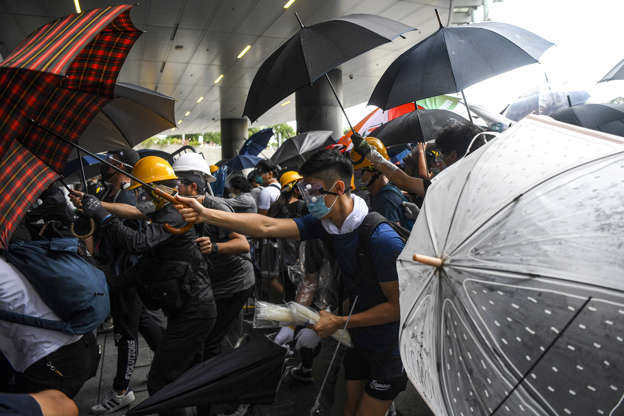 Slide 3 of 39: Protesters clash with police during a demonstration outside the Legislative Council Complex in Hong Kong on June 12.