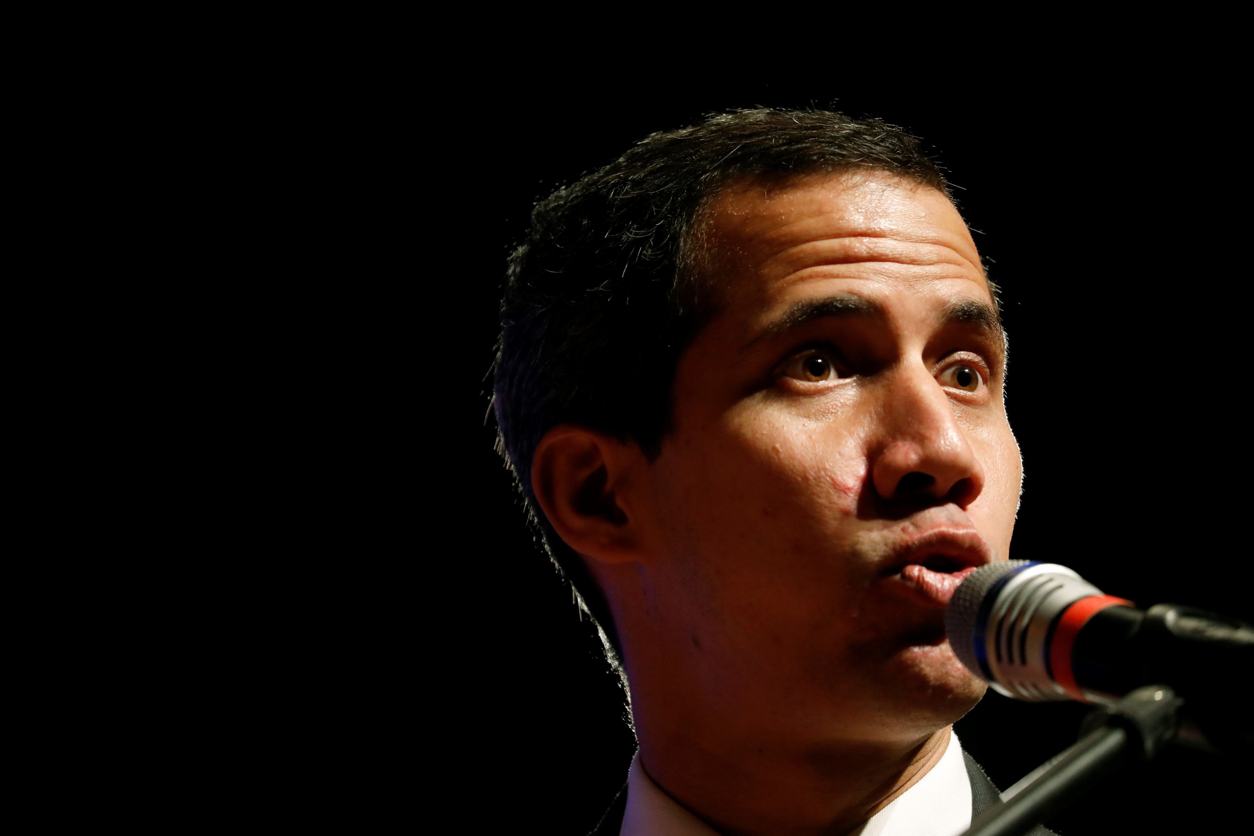Venezuela's opposition leader and self-proclaimed interim president Juan Guaidó presents details of his "Plan Pais" or Plans for the Country, during a meeting with the agro-food sector, in Caracas, Venezuela, Wednesday, June 19, 2019. (AP Photo/Ariana Cubillos)
