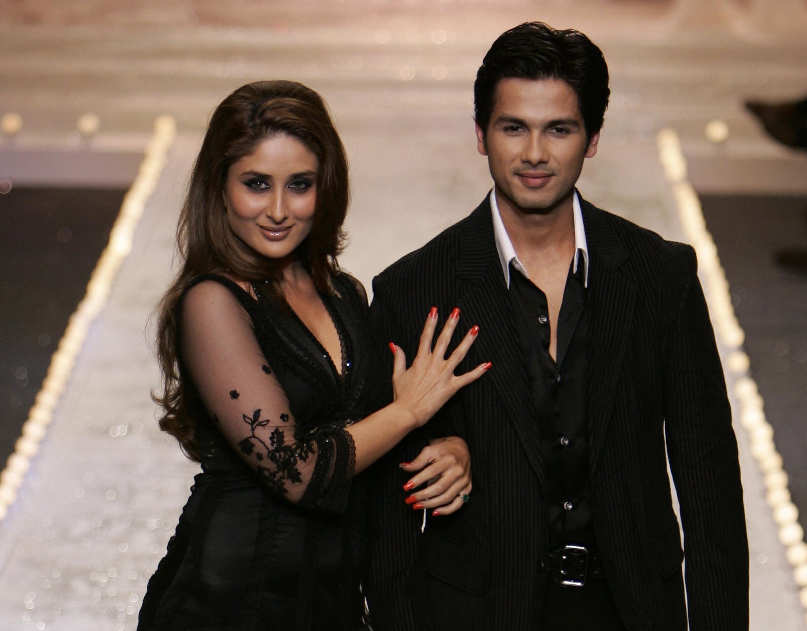 Slide 1 of 30: New Delhi, INDIA: Bollywood actors Kareena Kapoor(L) and Shahid Kapur(R) display creations of Indian designer Manish Malhotra during the grand fiinale on the last day of the Wills Lifestyle Fashion Week in New Delhi, 03 September 2006. India Fashion Week runs from 30 August to 03 September showcasing some 30 shows from some 75 Indian designers. AFP PHOTO/MANAN VATSYAYANA (Photo credit should read Manan Vatsyayana/AFP/Getty Images)