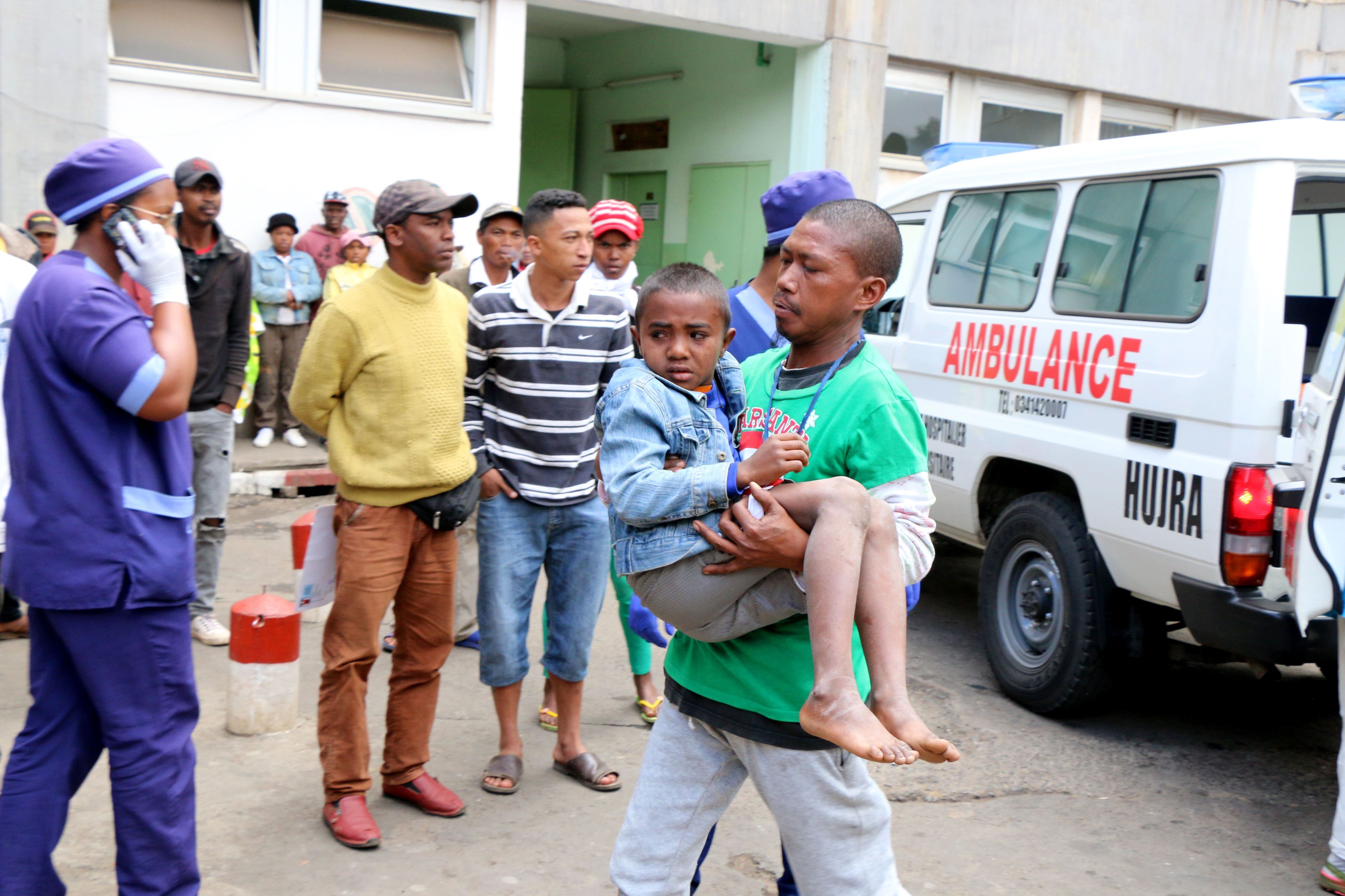 An injured child from a stamped outside a football stadium ahead of African Cup of Nations qualifier match between Senegal and Madagascar are rushed to the emergency room of the HJRA hospital on September 9, 2018 in Antananarivo, Madagascar. - At least one person was killed and nearly 40 were injured in a stampede ahead of an Africa Cup of Nations qualifier Sunday in which Madagascar hit back twice to draw 2-2 with Senegal. (Photo by Mamyrael / AFP)        (Photo credit should read MAMYRAEL/AFP/Getty Images)