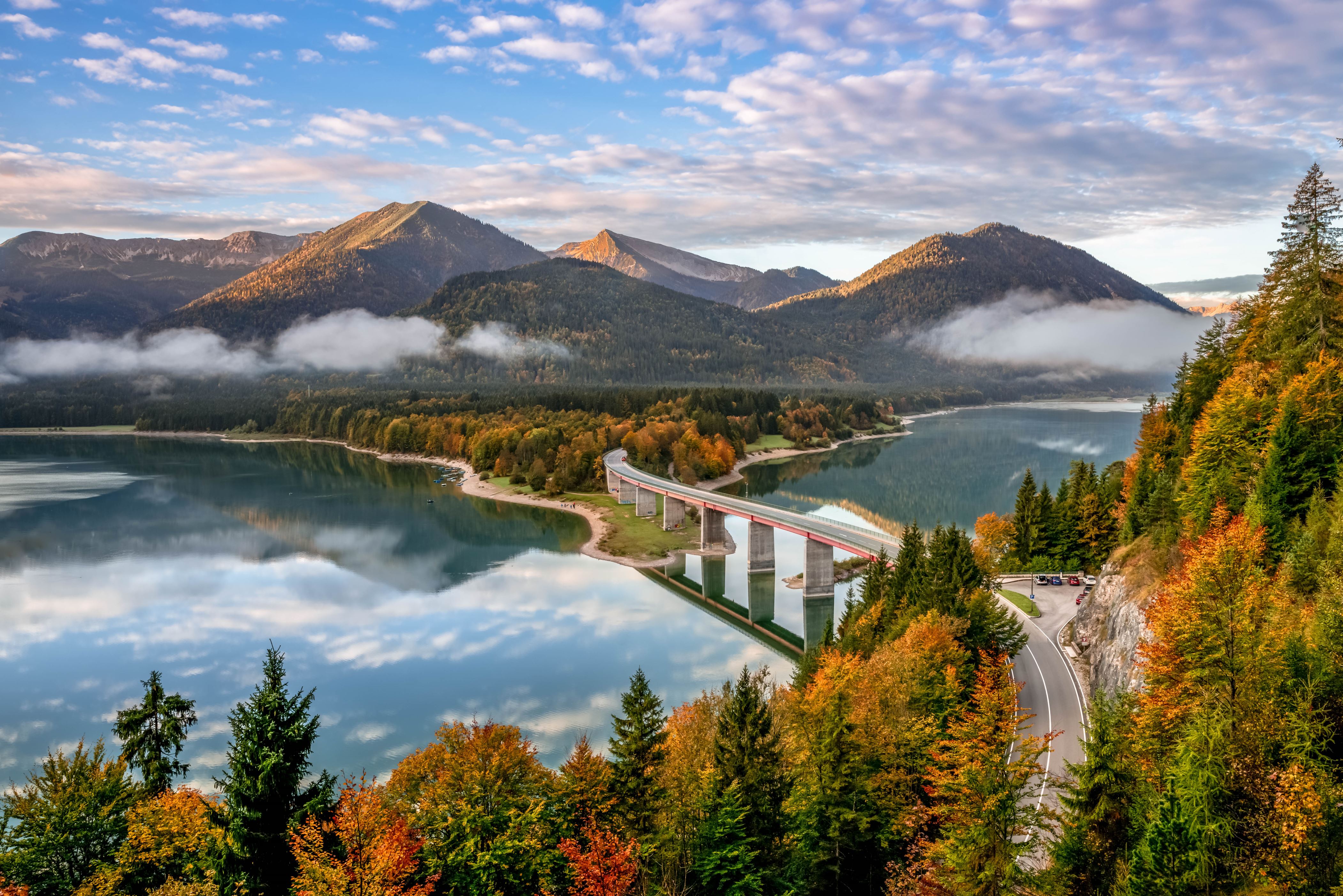 Sylvenstein Lake and bridge surrounded by the morning mist. Bad Tölz-Wolfratshausen district Bavaria Germany.