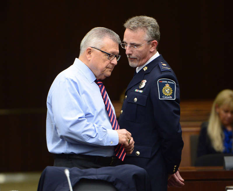 Public Safety Minister Ralph Goodale speaks with CBSA's VP in this file photo.