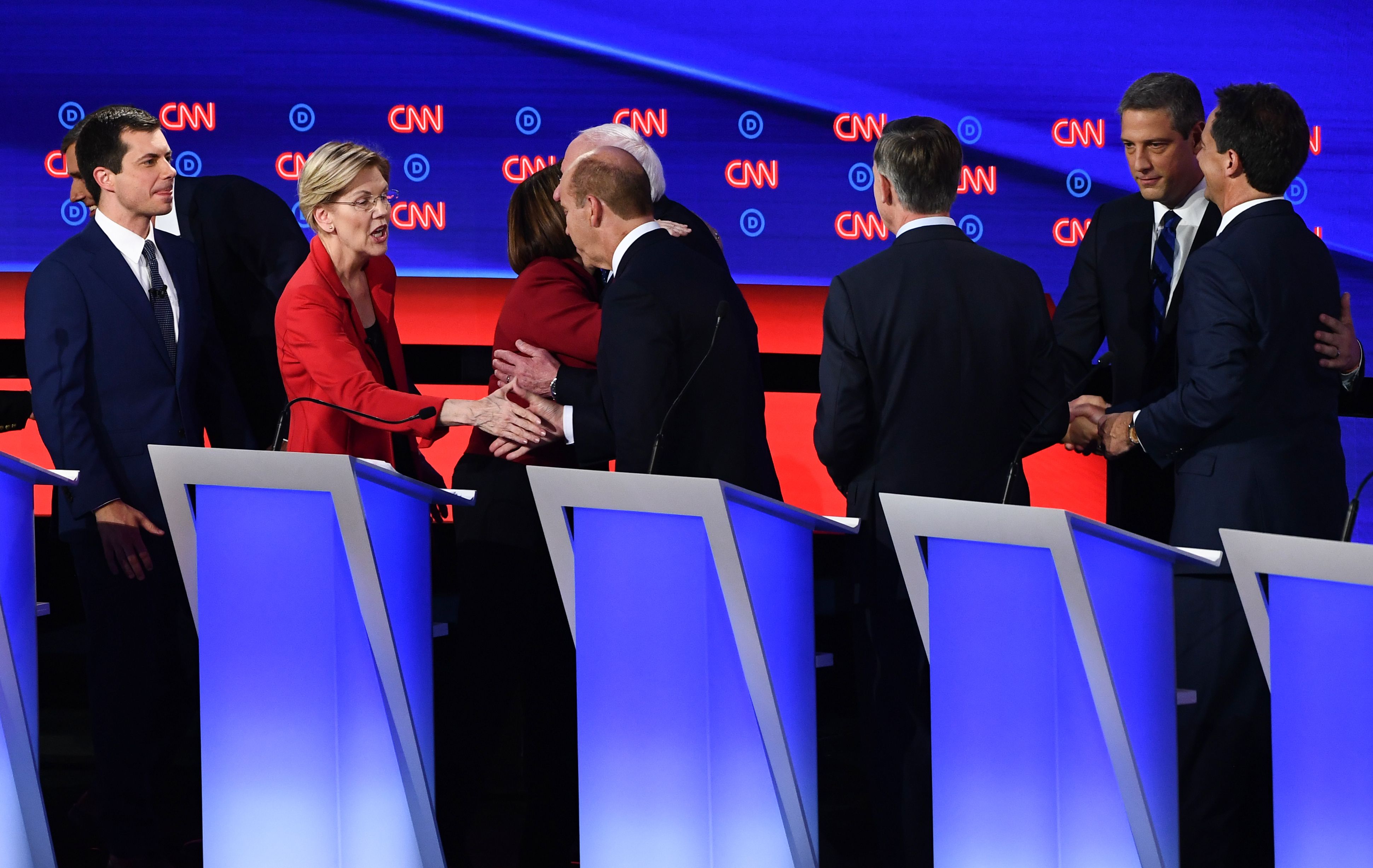 Slide 2 of 21: Democratic presidential hopefuls (L-R) Mayor of South Bend, Indiana, Pete Buttigieg, US Senator from Massachusetts Elizabeth Warren, US Senator from Minnesota Amy Klobuchar, US senator from Vermont Bernie Sanders, former US Representative for Maryland's 6th congressional district John Delaney, Former Governor of Colorado John Hickenlooper, US Representative for Ohio's 13th congressional district Tim Ryan and Governor of Montana Steve Bullock shake hands on stage after the first round of the second Democratic primary debate of the 2020 presidential campaign season hosted by CNN at the Fox Theatre in Detroit, Michigan on July 30, 2019. (Photo by Brendan Smialowski / AFP)        (Photo credit should read BRENDAN SMIALOWSKI/AFP/Getty Images)
