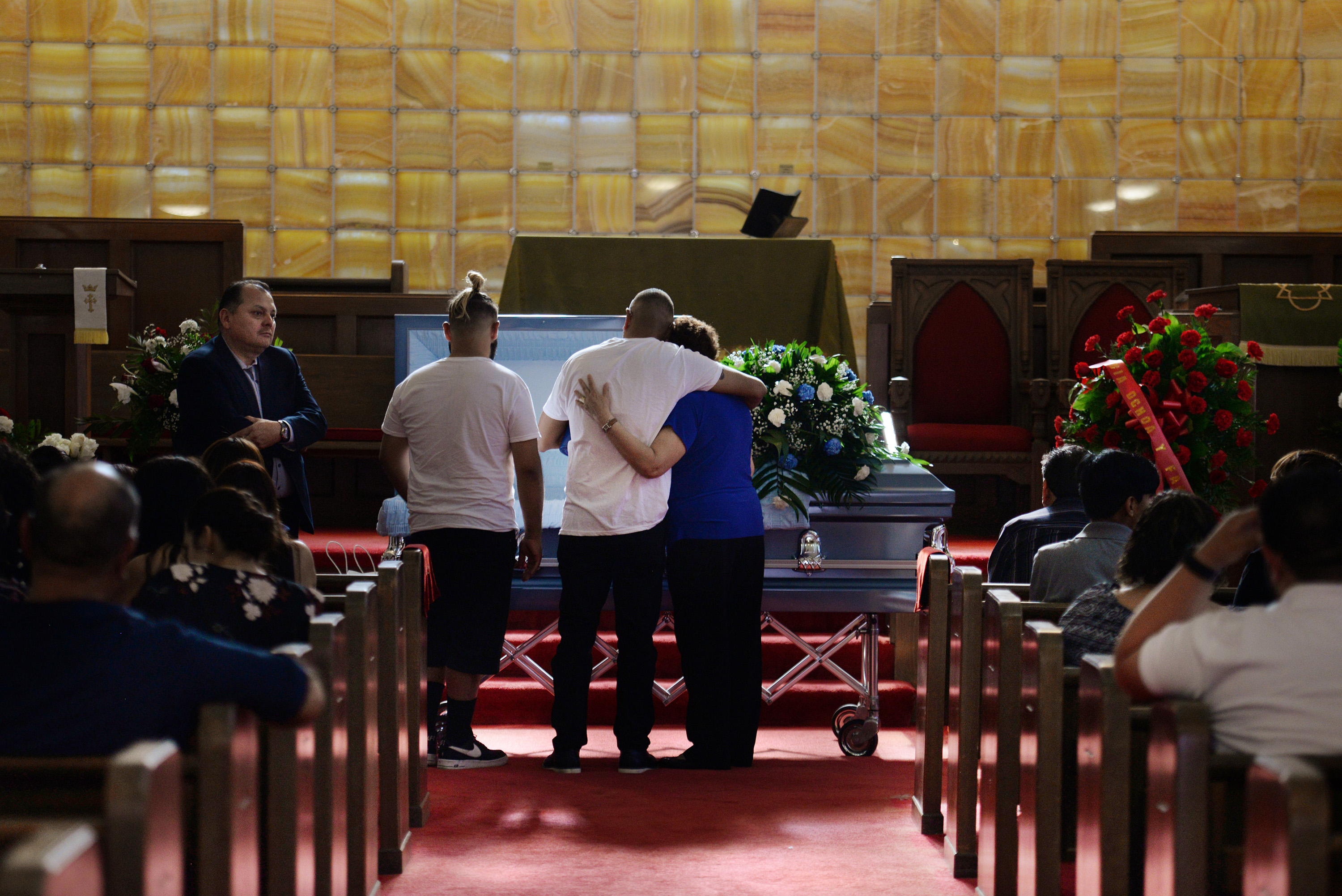 Slide 11 of 59: Friends and family gather for the visitation of Juan Velazquez five days after a mass shooting at a Walmart store in El Paso, Texas, U.S. August 8, 2019. REUTERS/Callaghan O'Hare