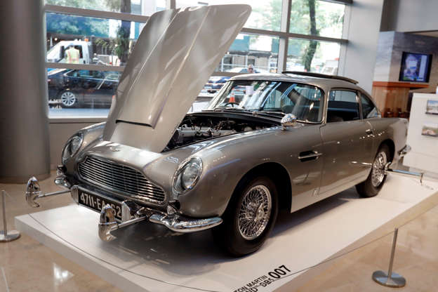 James Bond 1965 Aston Martin DB5 is displayed at Sotheby's, in New York, Monday, July 29, 2019. The car is one of just three surviving original examples commissioned, and fitted with MI6 Q specifications. It is estimated at $4 million - $6 million when offered at sale in Monterey, Calif, Aug. 15. (AP Photo/Richard Drew)