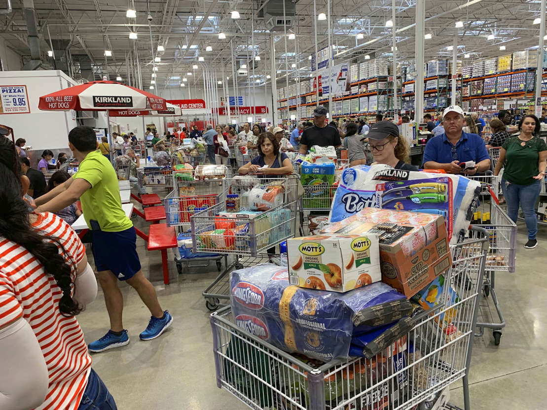 Slide 3 of 45: Shoppers wait in long lines at Costco, Thursday, Aug. 29, 2019, in Davie, Fla., as they stock up on supplies ahead of Hurricane Dorian. (AP Photo/Brynn Anderson)