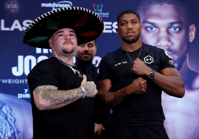 Boxing - Andy Ruiz Jr & Anthony Joshua Press Conference - Hilton London Syon Park, London, Britain - September 6, 2019   Andy Ruiz Jr and Anthony Joshua pose during the press conference as promoter Eddie hearn looks on   Action Images via Reuters/Peter Cziborra