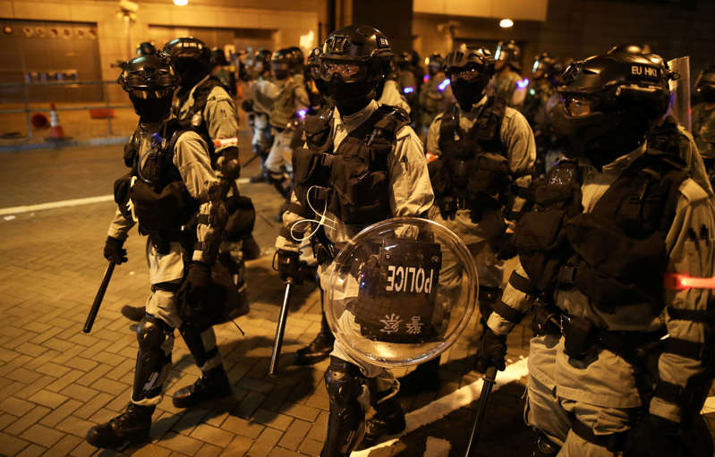 Riot police officers patrol the road during a protest against the invocation of the emergency laws in Hong Kong, China, October 14, 2019. REUTERS/Ammar Awad