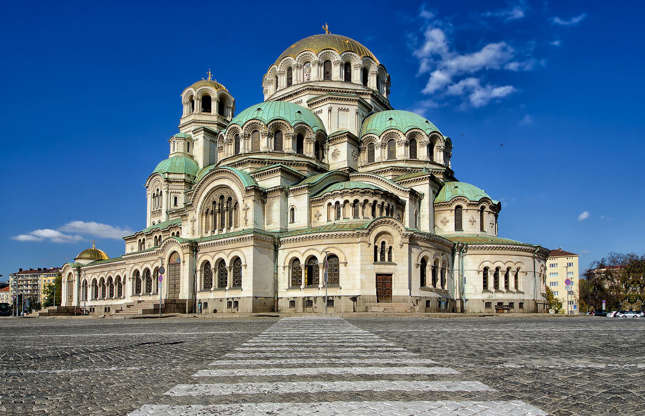 Slide 26 of 31: A symbol of the Bulgarian capital as well as a major tourist attraction, the St. Alexander Nevsky Cathedral is one of the largest Eastern Orthodox churches in the world. With several domes, including a gold-plated central dome, it was finished in 1912 and was built to honor the Russian soldiers who died during the Russo-Turkish War of 1877–1878, which helped liberate Bulgaria from Ottoman rule.