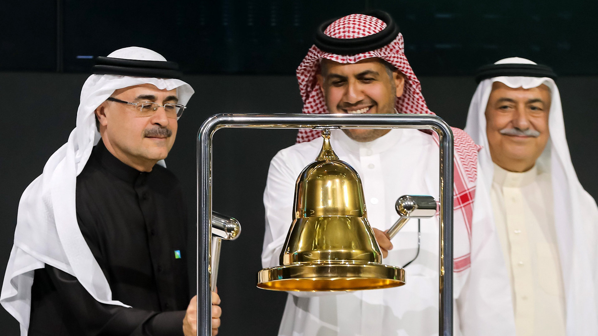 Ibrahim Abdulaziz Al-Assaf holding a microphone