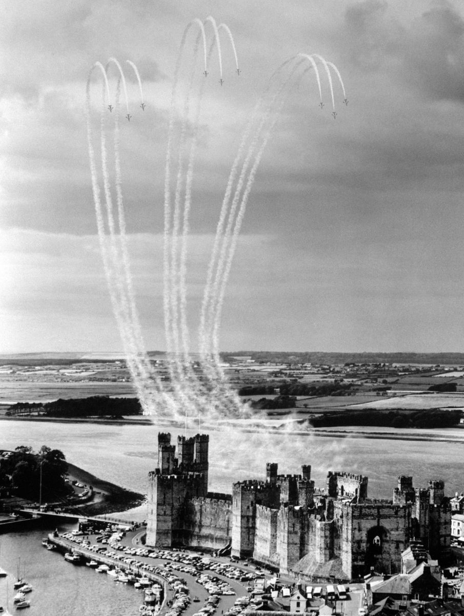 <p>On their wedding day, celebrations were seen throughout the United Kingdom. In Wales, the Royal Air Force performed a formation of the Prince of Wales Feathers over Caernarfon Castle. </p>