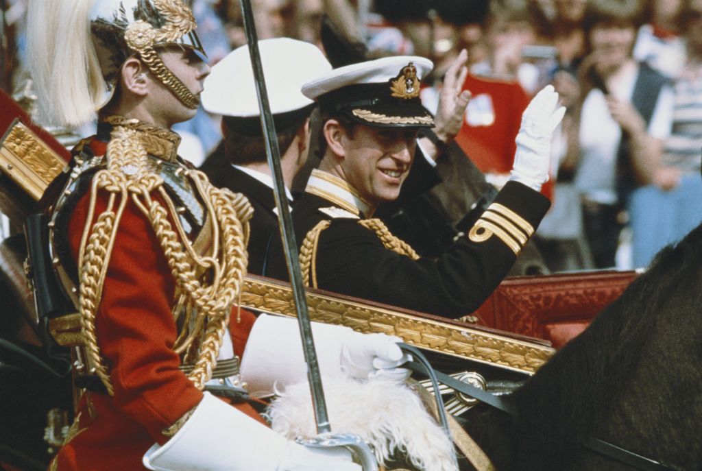 <p>Prince Charles waves to the excited crowds along the processional—an appropriate response to the many people who camped out ahead of his wedding, if you ask me.</p>