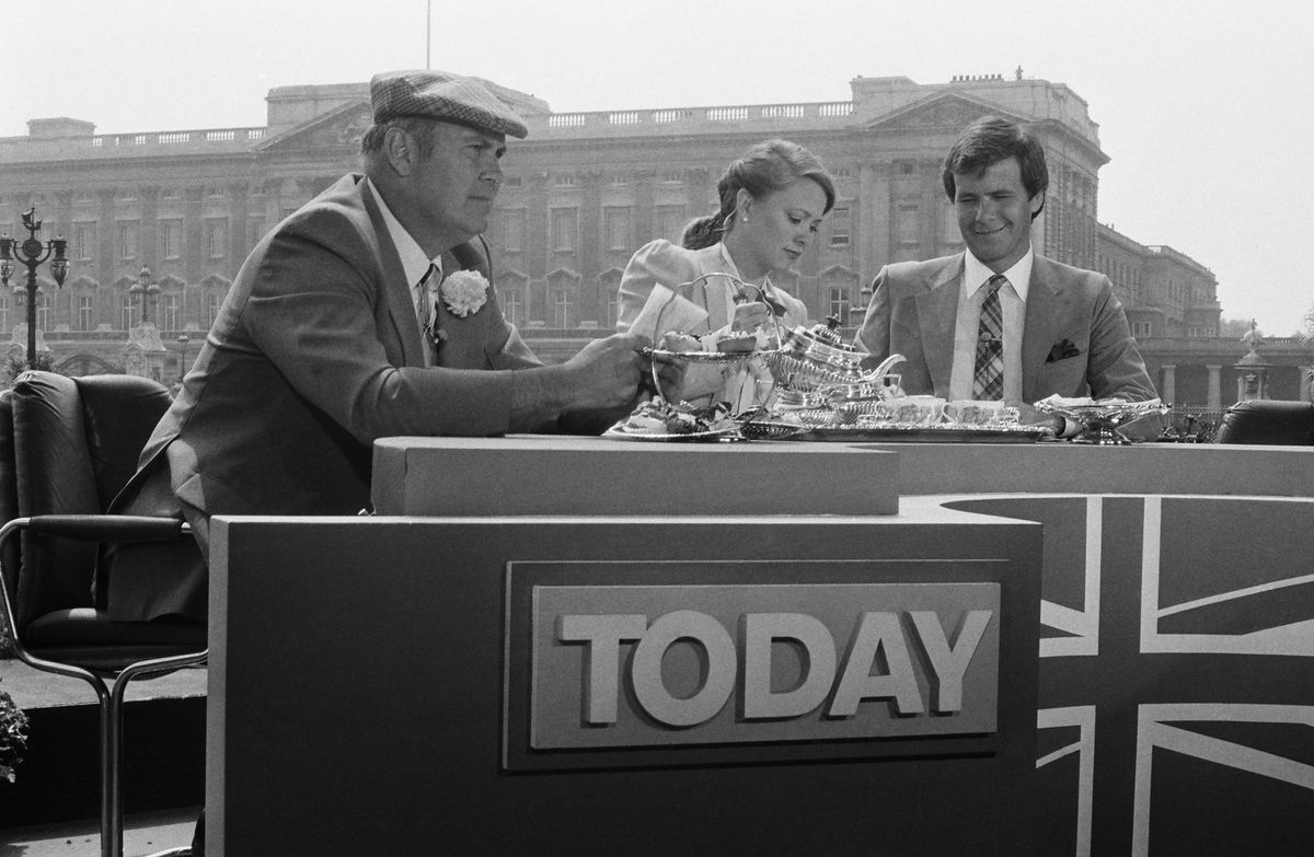 <p>Press from every nation, including the United States, set up outposts to live broadcast the events. Here, <em>Today </em>hosts Willard Scott, Jane Pauley, and Tom Brokaw enjoy a spot of tea (as one does) before the ceremony. </p>